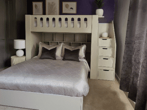 Bunk Bed with double on bottom and sinlge on top, storage in the stairs and shelving included.