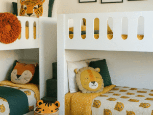 Funky L-shaped quad bunk bed styled in a modern kids’ room with colorful bedding, wall art, and cozy lighting.