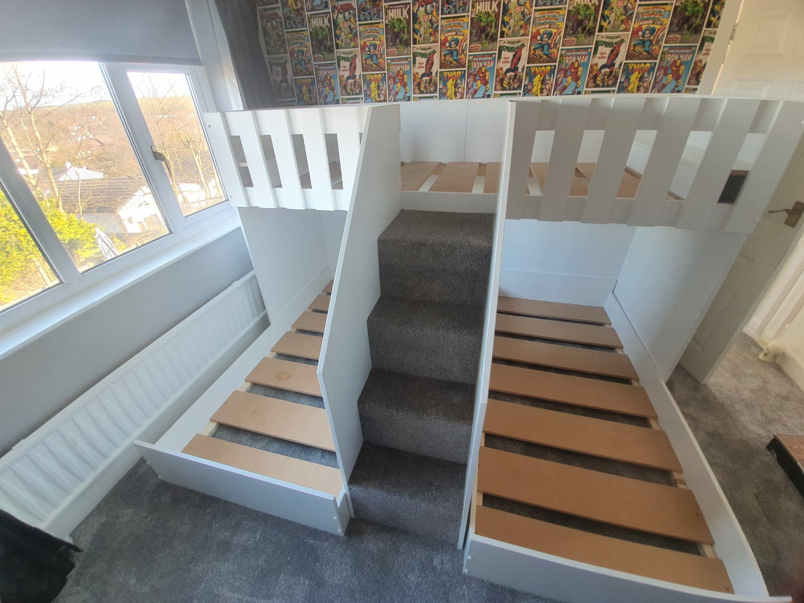 M Shape triple bunk. single mattress size. drawers in the stairs. stair case. gate on the stairs. funky bunk beds
