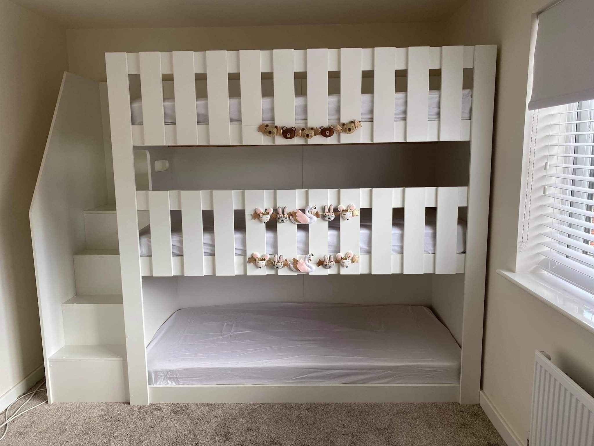 triple tier bunk with stairs in white. latts on top rail. funky bunk beds. childrens bedroom furniture inspiration.